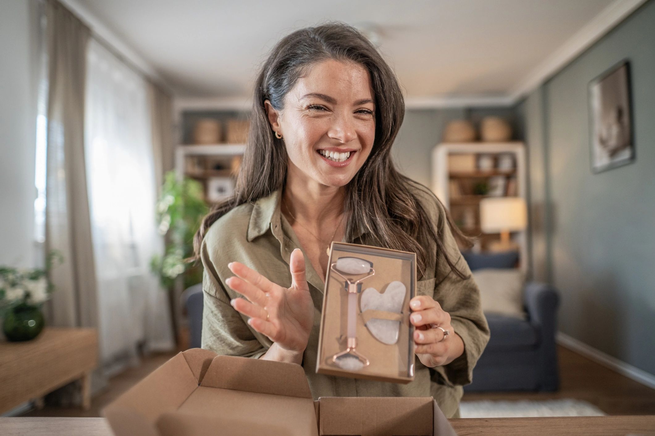 Customer unboxing a gift set at home