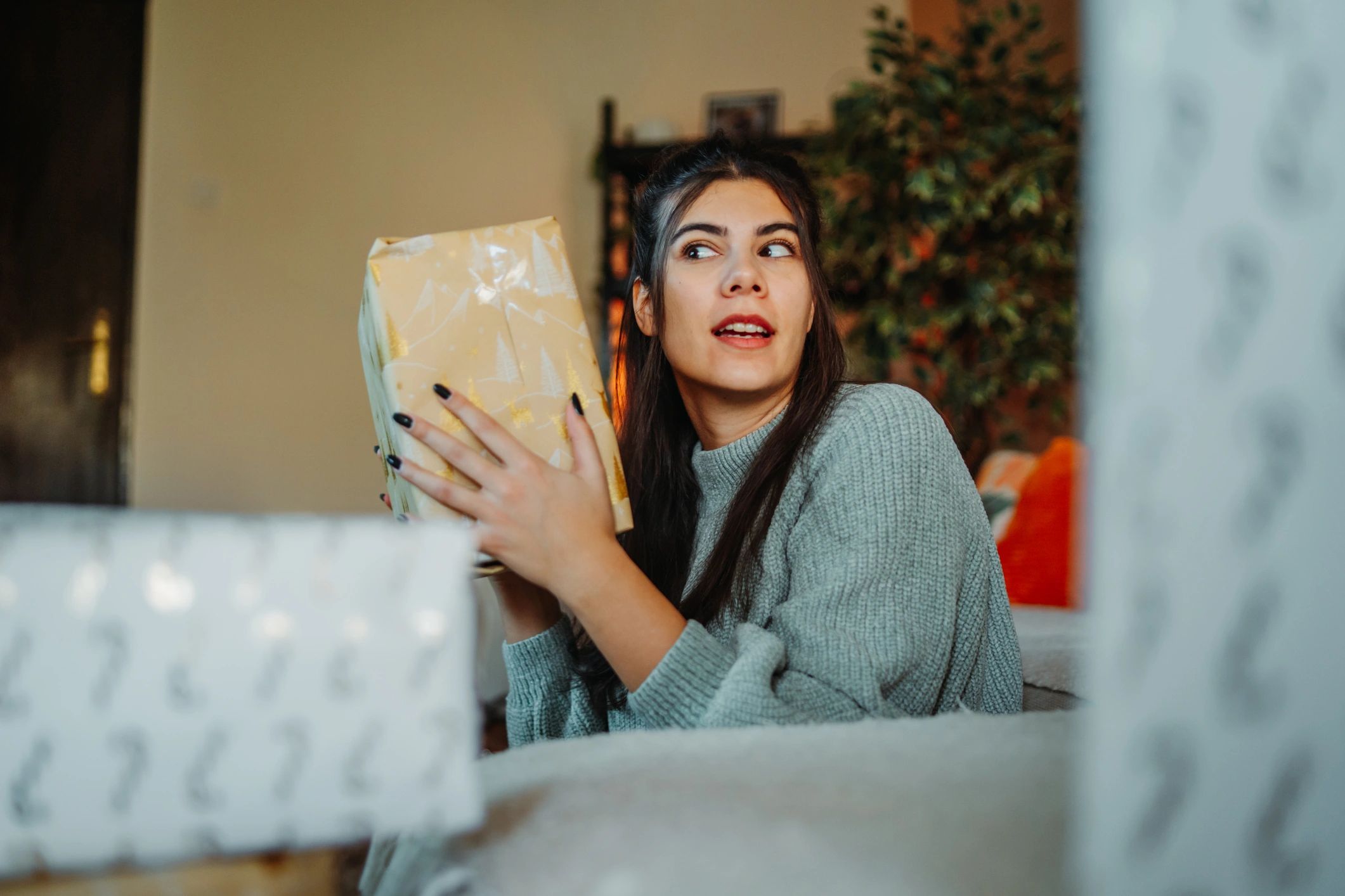 Person holding a wrapped gift