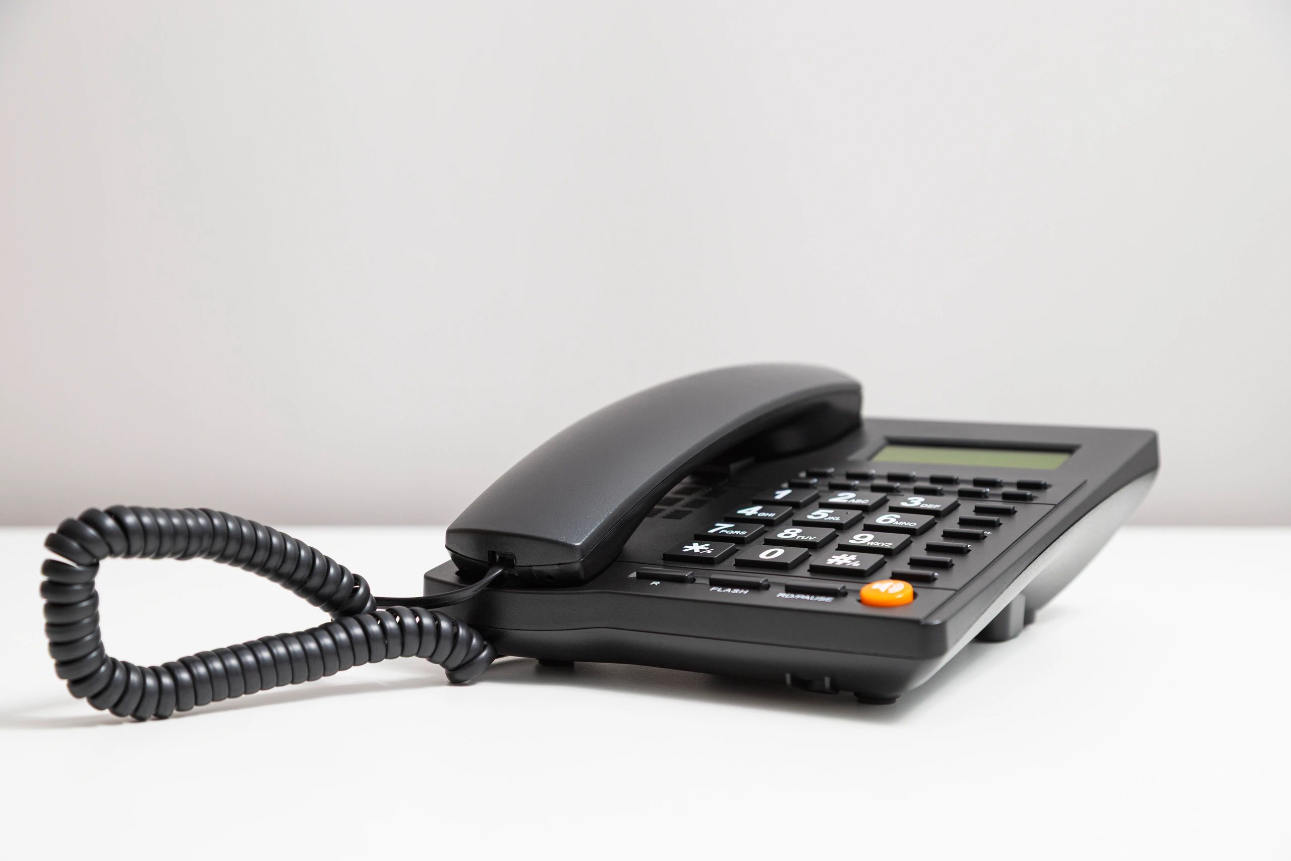 Telephone on a desk representing customer support